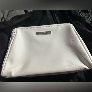 White with blue inside make up or other bag.